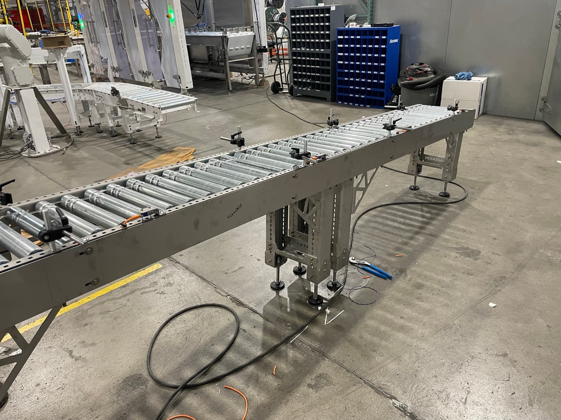 Stainless 24V MDR conveyor section with sealed drive card connections in the AQS shop