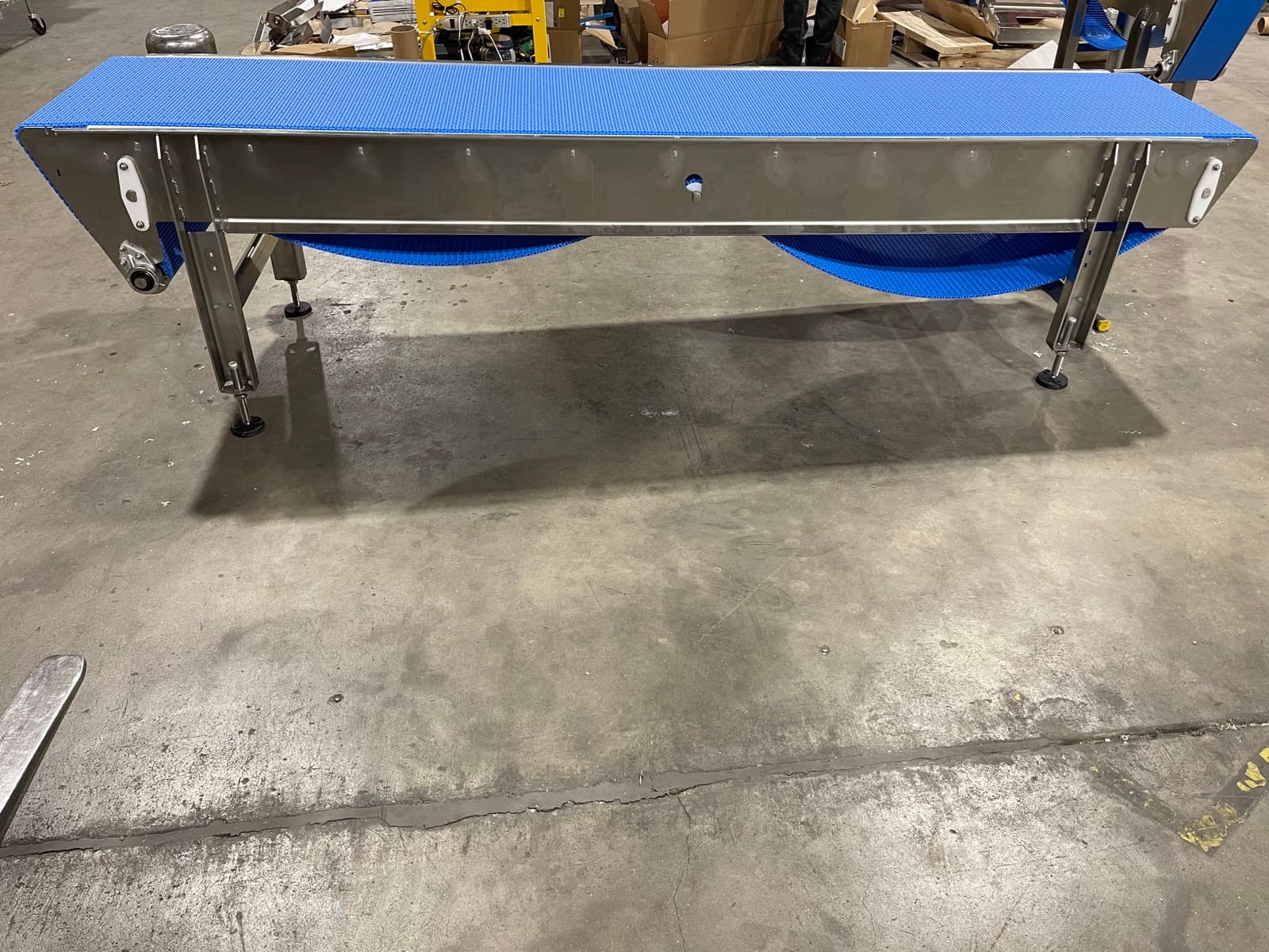 Blue modular belt conveyor on a TIG-welded stainless frame ready to ship from the AQS shop