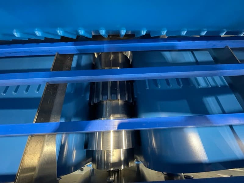 Close-up of sanitary conveyor motor and drive assembly with stainless steel construction